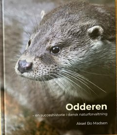 Front cover of the book, with a closeup of the head of an Eurasian Otter turned to look to the left.  The book titile and author are in white text superimposed on the image in the bottom right.